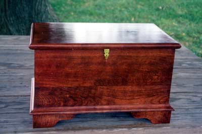 Blanket chest like container for horse cremains. A brass plate is included free of charge. Three lines of text may be engraved.