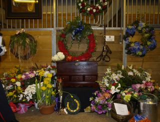 "Brigadier's stall, with a rosewood urn for his ashes, that was graciously donated by someone who was touched by this tragedy. Carrots, apples and other treats have been filling the hallway for a week."